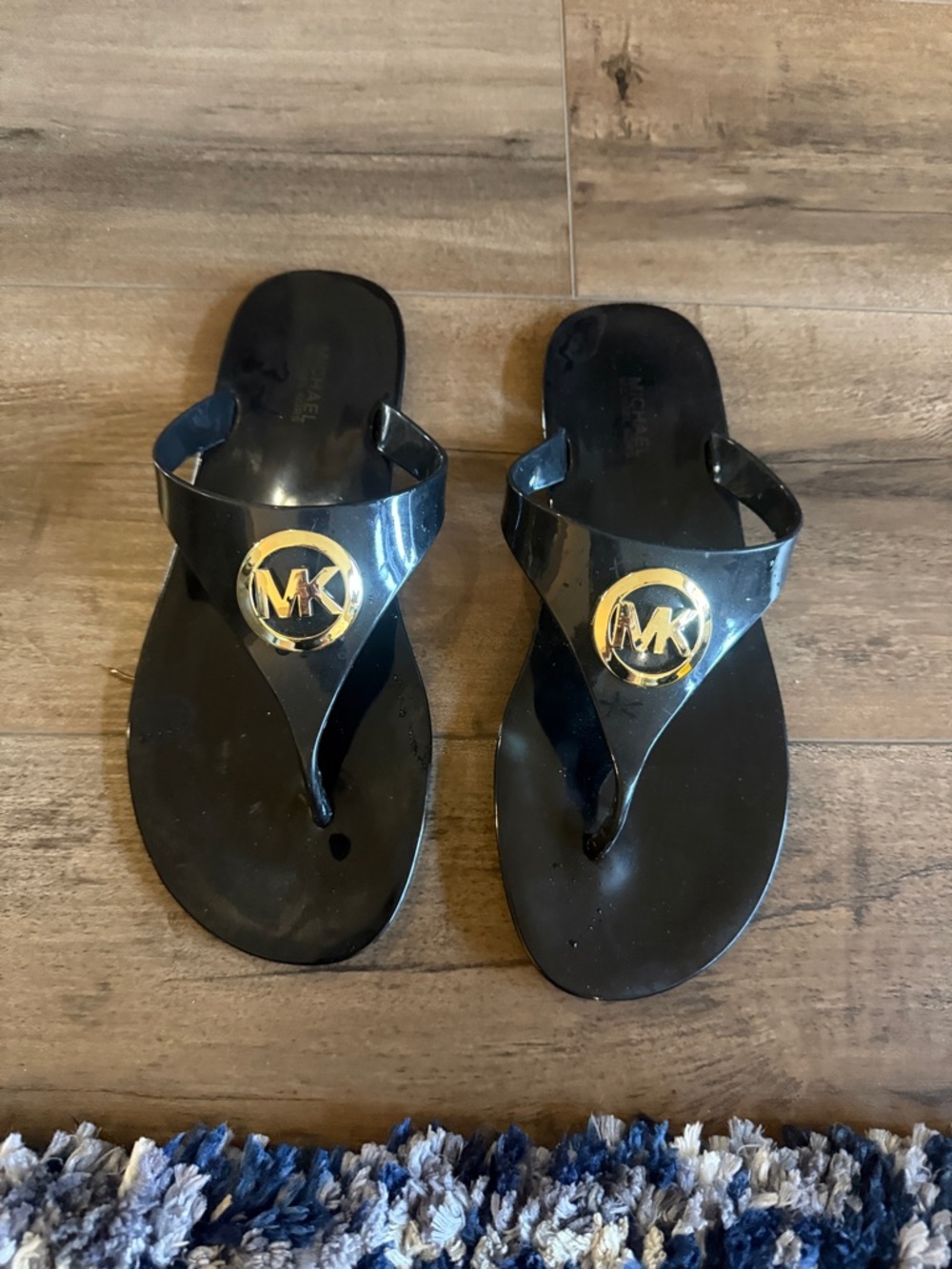 Michael Kors Black Jelly Flip Flops with Gold MK Emblem